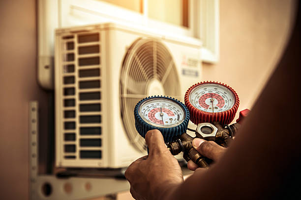 Professional Air Conditioning Service technician working in Sandoval, IL